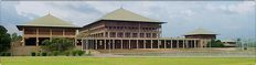 the building is made of wood and has many windows