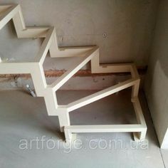 an unfinished stair case in the corner of a room