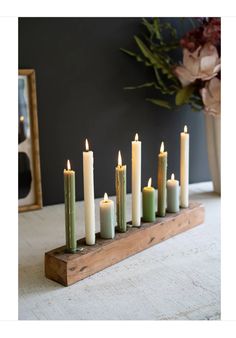 a group of candles sitting on top of a wooden table