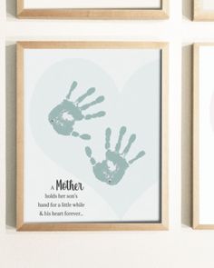 there are four framed pictures with hand prints on them, one is for mother and the other is for son