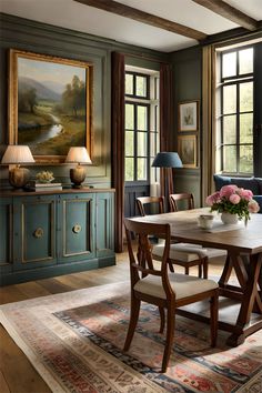 a dining room with green walls and wooden furniture, along with an area rug on the floor