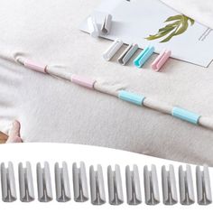 several toothbrushes laying on top of a bed next to a pillow and paper