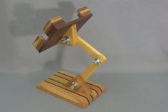 a wooden desk lamp with metal fittings on it