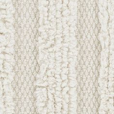 a close up view of a white rug