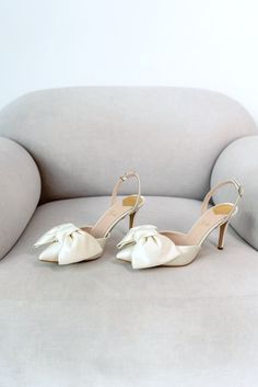 Bridal shoes 'JENNA' are handcrafted from soft Italian satin and have a 9 cm / 3.5 inches pointy heel.  Elegant yet minimalistic wedding sandals will perfectly complement your wedding gown. Sandals decorated with a fabulous satin bow. Can be made with lower heels. Inside there is a soft Memory foam insole, which gives a feeling of additional comfort when walking. Tunit outsole is made of a mixture of leather chips and rubber, it's more wear-resistant than leather and more durable. Also, we use s Wedding Shoes Bows, Wedding Slingback Sandals With 4-inch Heel And Pointed Toe, Wedding Slingback Pumps With 4-inch Heel, Summer Wedding Slingback Sandals With Pointed Toe, White Slingback Sandals With 4-inch Heel, Elegant Cream Slingback Pumps With 4-inch Heel, Wedding Slingback Pumps With 4-inch Pointed Heel, Summer Wedding Slingback Sandals, Elegant Cream Sandals With Pointed Toe