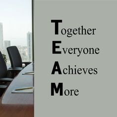 a conference room with chairs and a sign that says, together everyone achieves more