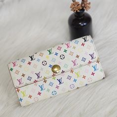 Authentic Pre-Owned Louis Vuitton Multicolor Portefeuille Sarah Wallet Approximate Size: W 7.48" X H 3.93" X D 0.98" Includes: N/A Date Code: Th0096 Condition Details: Pre-Owned And 100% Authentic. The Over All Condition Is Very Good. There May Be Signs Of Rubs, Scratches, Tarnish, Stains, And Normal Signs Of Use. Please Check The Photos For More Details. Important: The Item Is 100% Authentic And Pre-Owned. We Try Our Best To Describe The Condition Of Each Item With Pictures, Sometime Minor Flaw Louis Vuitton Murakami, Louis Vuitton White, Louis Vuitton Multicolor, Pre Owned Louis Vuitton, Bags Louis Vuitton, Louis Vuitton Bags, Louis Vuitton Bag, Bag Lady, Louis Vuitton