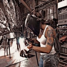 a woman working in a factory with lots of work on her face and hands,