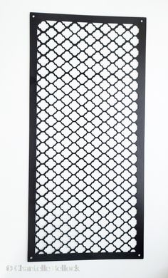 an iron screen mounted on the wall