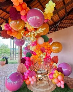 an outdoor party with balloons and decorations