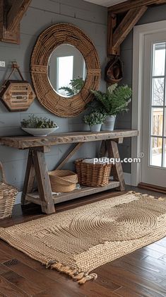 a wooden table sitting on top of a hard wood floor next to a window and potted plant