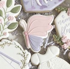 some decorated cookies sitting on top of a table