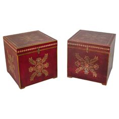 two red and gold decorated boxes sitting next to each other