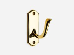 an image of a gold door handle on a white background with the letter u in it