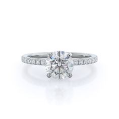 a diamond engagement ring with channel set shoulders