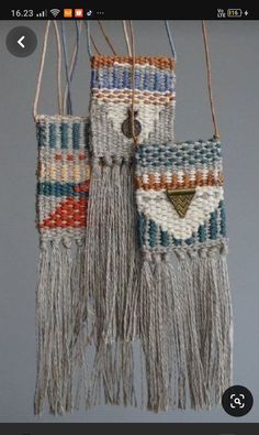 two small woven bags hanging from strings