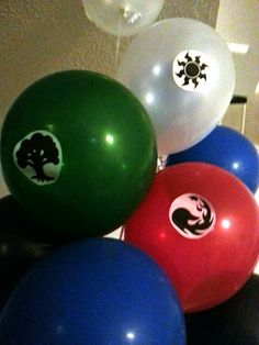 there are many balloons with different designs on them