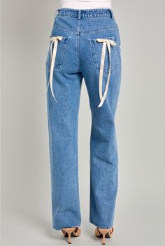 Denim pants with light beige bows on the back pockets. Straight leg. High waisted. Material: 100% Cotton Model is wearing a size small. Bow Jeans, Chic Romper, Bralette Tops, Top Graphic Tees, Leg Design, Trendy Clothes For Women, Cozy Knits, Bow Detail, Light Beige