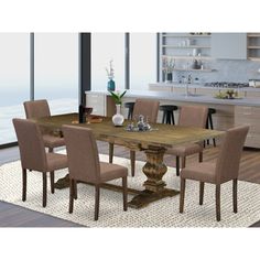 a large wooden table surrounded by beige chairs