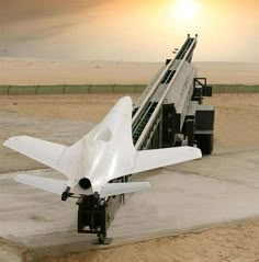 an airplane sitting on top of a cement runway