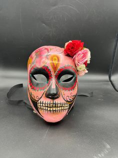 Mexican Skull This mask is a traditional and original papier-mache Venetian mask, handmade and decorated in our Atelier in Venice. It is perfect for any masquerade party, Halloween costume, pro or event in Venice or elsewhere during Carnival. This mask can be gently bent to form to your face and ties in the back with two soft matching ribbons. Size: one-size Colors: multicolor Each mask is an original design and is decorated by hand in the in Venice. Our decorators use techniques typical of the Skull Female, Sugar Skull Mask, Venice Mask, Mexican Skull, Mexican Skulls, Costume Masks, Venetian Mask, Skull Mask, Female Face