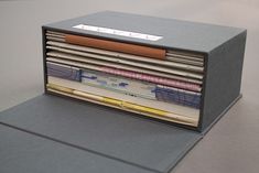 a stack of folders sitting on top of a table