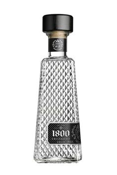 an empty glass bottle with a black cap on it's top and the word 1800 written