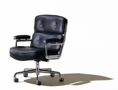 an office chair with black leather upholstered seat