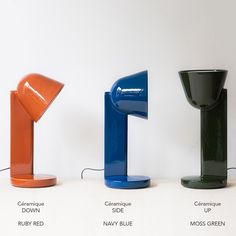 three different colored lamps sitting next to each other