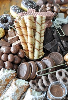 an assortment of desserts and pastries on a table