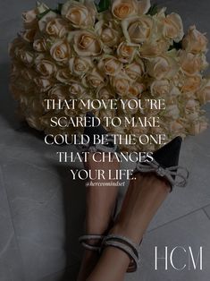 a woman's feet with flowers on the ground and a quote that reads, that move you're scared to make could be the one that changes you life