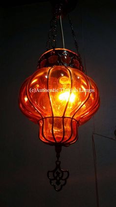 an orange light hanging from the ceiling