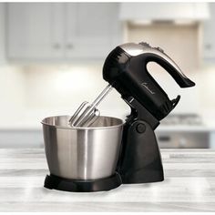 an electric mixer sitting on top of a kitchen counter