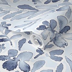 a blue and white wallpaper with watercolng on it's surface is shown