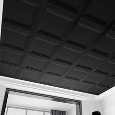 a black and white photo of a bedroom with the ceiling painted in dark gray tones