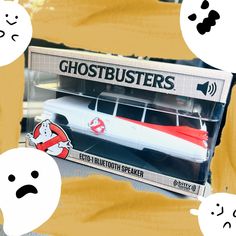 a box with ghostbusters on it sitting in front of some other toys and stickers