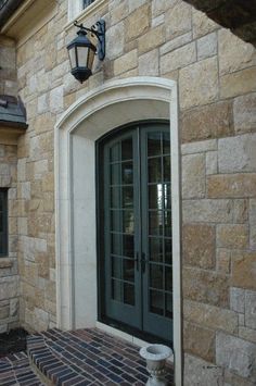 an outside view of a building with a door and windows