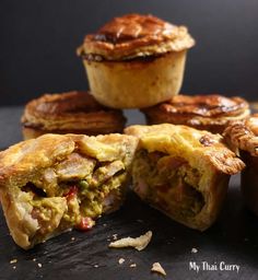 several pastries sitting on top of a table next to each other with one bite taken out