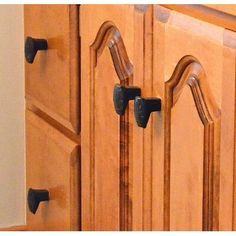 an image of kitchen cupboards with handles on them