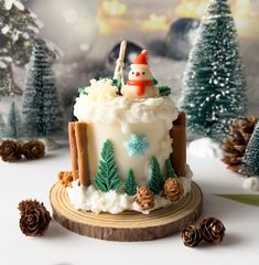 a christmas cake decorated with frosting and decorations