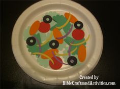 a white paper plate with colorful designs on it