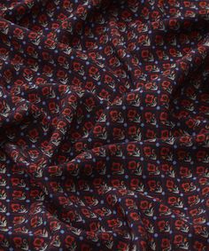 a red and blue floral print fabric