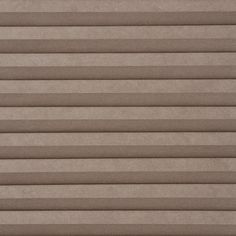 a close up view of a tan colored blind with horizontal blinds on the top and bottom