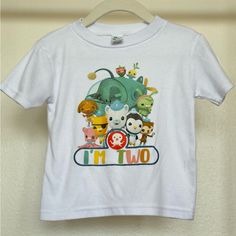 a white t - shirt with cartoon characters on it