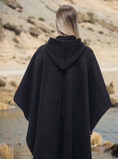 Material: Alpaca woolColor: Black Size:Length: 180 cm (70.86") Width:112 cm (44.09") It refers to the total measurements of the poncho when it is fully open (like a blanket) Note: Since this product is is handmade, it may present slight variations from the pictures. Description: Black Poncho with hood. Soft to the touch: Alpaca wool is extremely soft. It is softer than any other alternative wool. The fabric quality and the way we knit our products make them unique.Warm: You will notice how the A Black Winter Cape For Outdoor, Black Winter Outdoor Cape, Black Alpaca Poncho For Winter, Winter Wool Poncho For Cold Weather, Cozy Black Wool Outerwear, Black Alpaca Cape For Winter, Black Wool Poncho For Winter, Wool Cape Poncho One Size, One Size Wool Poncho Cape