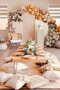 a living room filled with lots of furniture and decor on top of a wooden floor