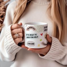 a woman holding a coffee mug with the words i'm sorry it's okay to ask for help