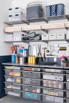 a garage storage area with bins and drawers