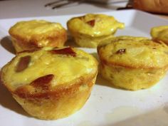 several small muffins are on a white plate