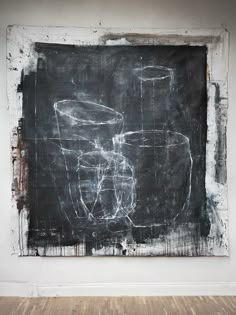 a black and white painting in an empty room